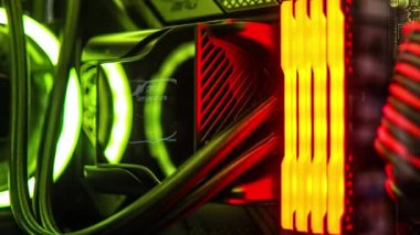 High End gaming pc, PC master race and enthusiast PC building concept. RGB RAM DDR5 Memory illuminating the internal component of expensive gaming computer.