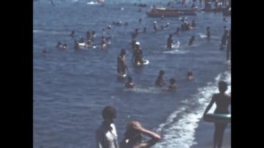 Liguria, Italy june 1960: People at restaurant on the beach scene in 60s