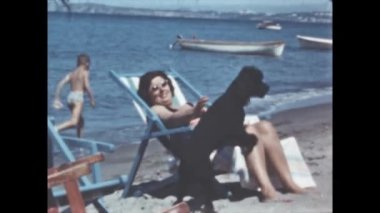 Liguria, Italy june 1960: People on vacation at italian beach in 1960s