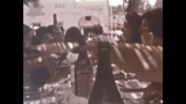 Liguria, Itally August 1965: Family lunch outdoor scene in 60s
