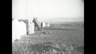 Catanzaro, Italy august 1962: Old village local people busy in daily activities in 60s