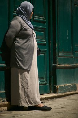 Nice, France 20 august 2022: Gypsy woman who lives in a pile of extreme poverty dressed in dirty clothes that begs alms.