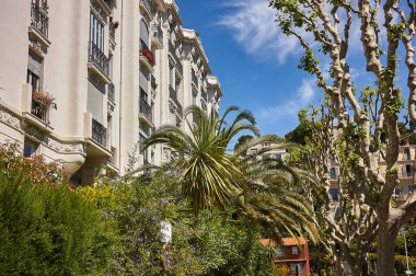 Nice, France 20 august 2022: Typical nice building, nestled in the greenery of the surrounding vegetation.