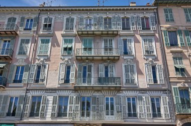 Nice, France 20 august 2022: textures of windows and balconies in baroque style of a nice condominium in france.