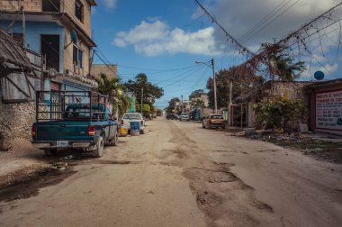 Tulum, Mexico 20 august 2022: View of the center of a dirt road of Tulum in Mexico: A scene of the daily life of this small town of the Mayan Riviera