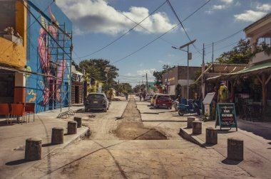 Tulum, Mexico 20 august 2022: Colored street of the small town of Tulum with some walking people