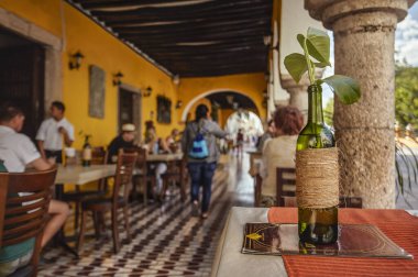 Valladolid, Mexico 20 august 2022: Green ornamental bottle