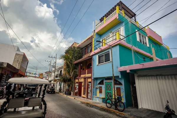 Valladolid, Mexico 20 august 2022: Small blue building opens the view to a small island of Isla Mujeres in Mexico.