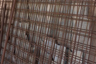 Set of iron mesh for concrete casting in the construction site - rusty electro-welded net on the building site to favor the pouri