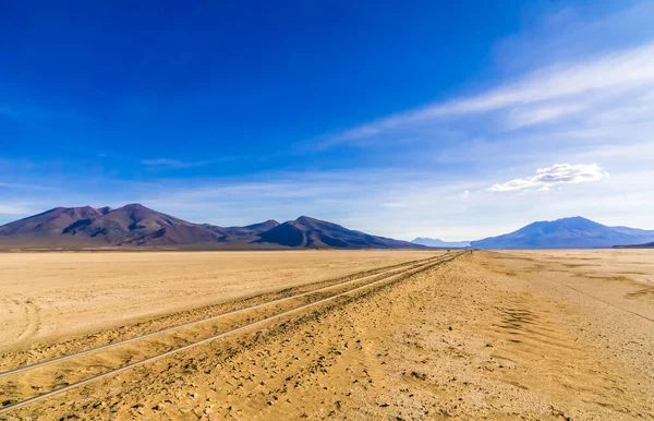 Old railway in Salar de Uyuni salt flat, Bolivia — Stok fotoğraf