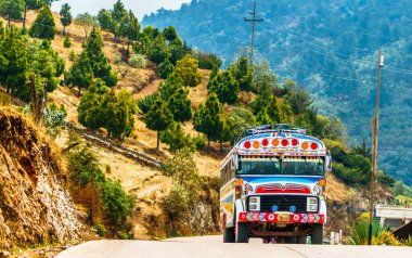 Old school bus used as public transport by Todos Santos Cuchumatan in Guatemala. High quality photo clipart