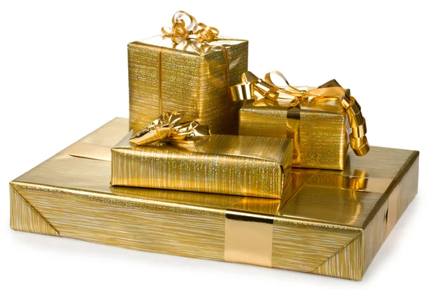 Gift boxes with golden ribbon and wrap — Stock Photo, Image