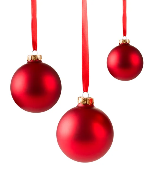 Drei rote Weihnachtskugeln hängen lizenzfreie Stockfotos