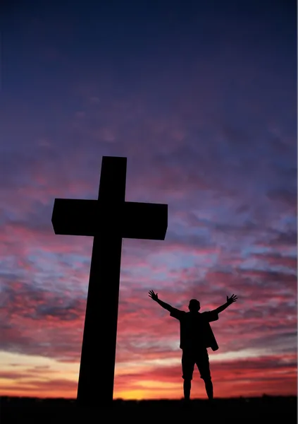 Silhouette of a man at the cross — Stock Photo, Image