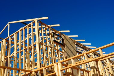 Abstract of New Home Construction Site Framing clipart