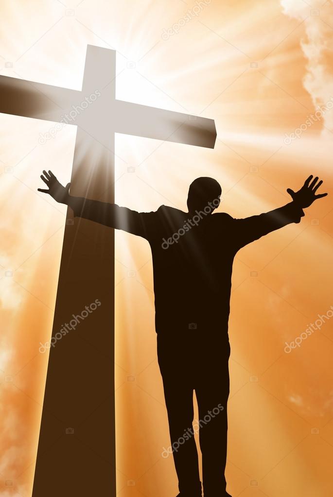 Silhouette of a man at the cross
