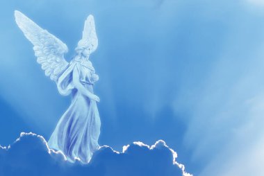 Angel on white cloud against blue clear sky with copy space