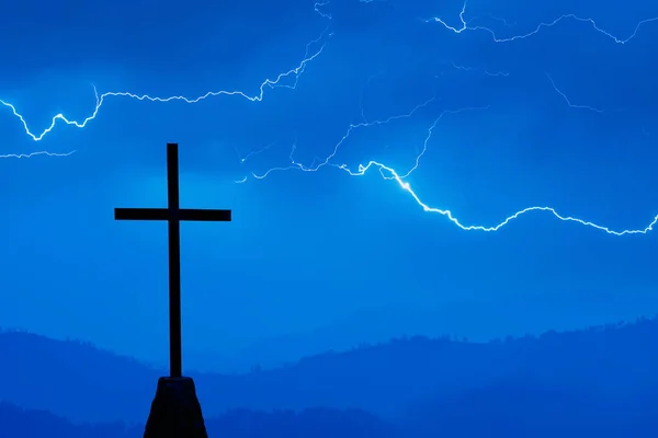 Lightning Bolts hitting behind religious cross