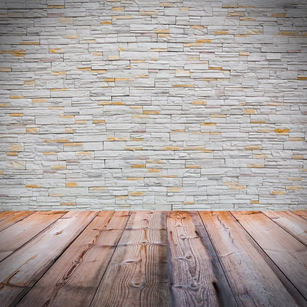 Witte bakstenen muur met houten vloer — Stockfoto