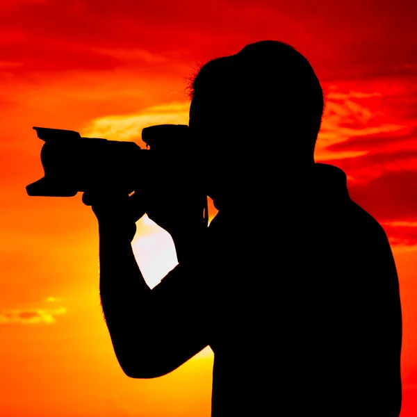 Silhouet van een fotograaf — Stockfoto