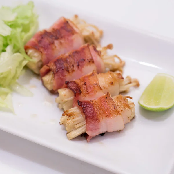 Japanese cuisine, bacon and Enoki Mushroom roll — Stock Photo, Image