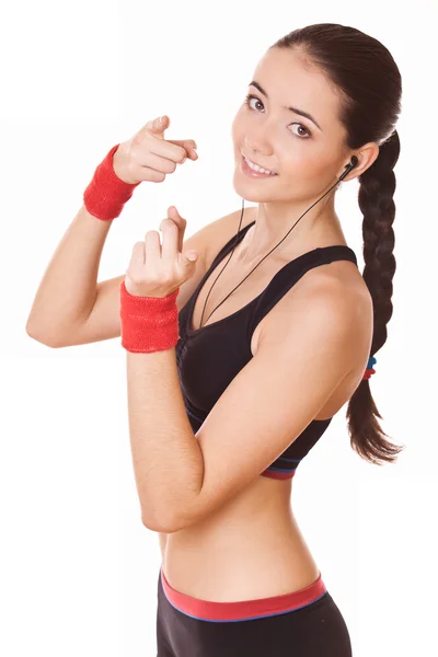 Mujer deportiva muestra hacia usted —  Fotos de Stock