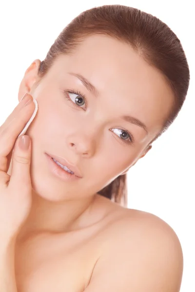 Woman cares for face touching cotton pad — Stock Photo, Image