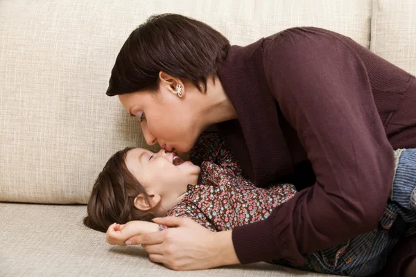 Mother kisses child — Stock Photo, Image