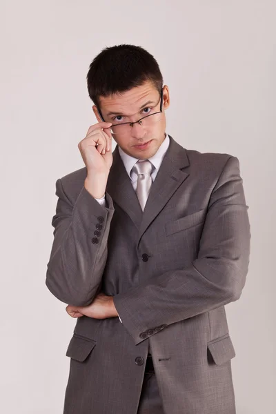 Confident men looking out for glasses — Stock Photo, Image