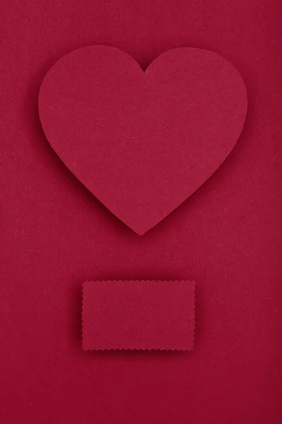 Red paper heart on red background — Stock Photo, Image