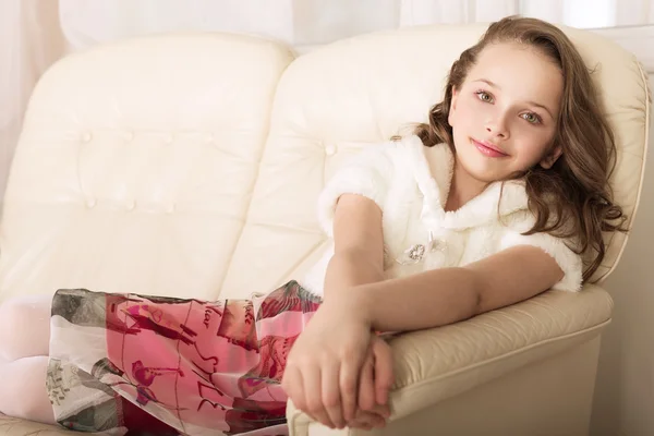 Fashion little girl on sofa — Stock Photo, Image