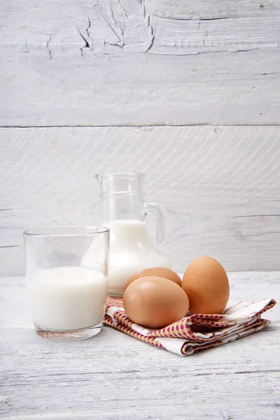 Fresh milk with eggs — Stock Photo, Image