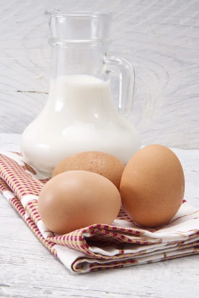 Fresh milk with eggs — Stock Photo, Image