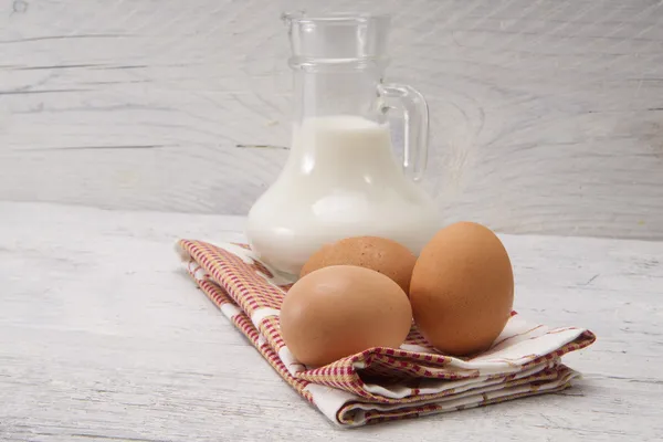 Fresh milk with eggs — Stock Photo, Image