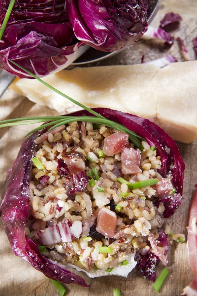 Brown rice with red radicchio and speck — Stock Photo, Image