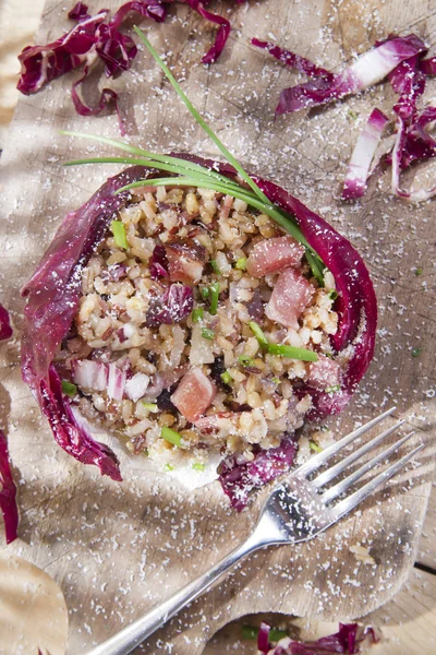 Brown rice with red radicchio and speck — Stock Photo, Image