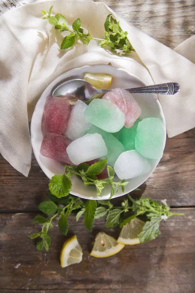 Bowl of colored ice-cubes — Stock Photo, Image