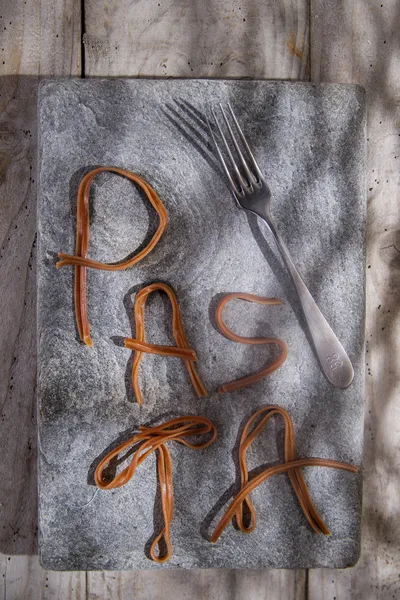 Pasta on a stone for advertising — Stock Photo, Image