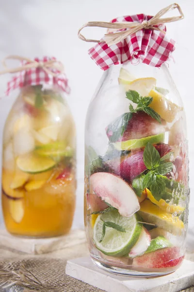 Infusion of tea peach and lemon — Stock Photo, Image