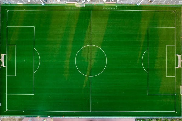 Aerial photographic documentation of an empty green football pitch