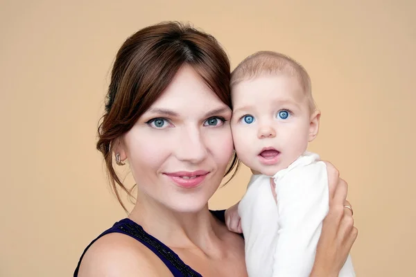 Mother holding sweet baby Stock Photo