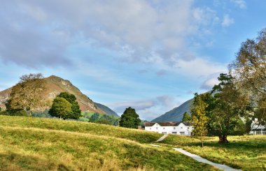 Helm Crag viewed from Grasmere, on a summers day. clipart