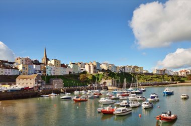 View of Tenby harbour and town on a summers day . clipart