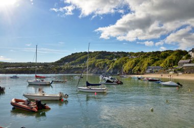 View of boats in New Quay harbour, Wales. clipart
