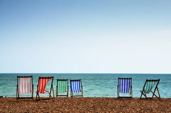 Nyugágyak, a brighton beach — Stock Fotó