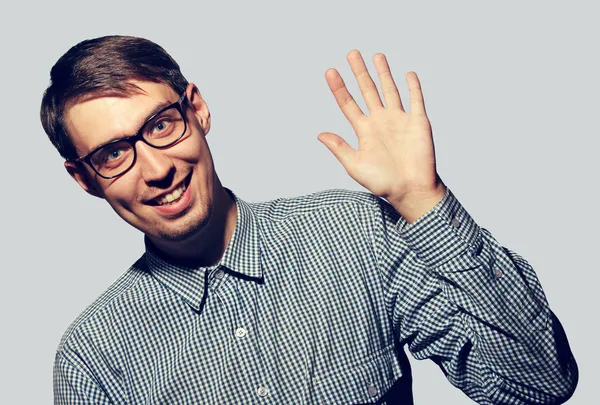 Funny young man wearing glasses say Hello Stock Image