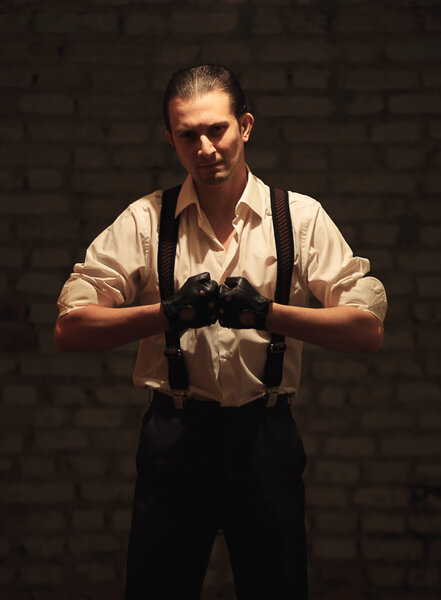 Portrait of young serious mafia man