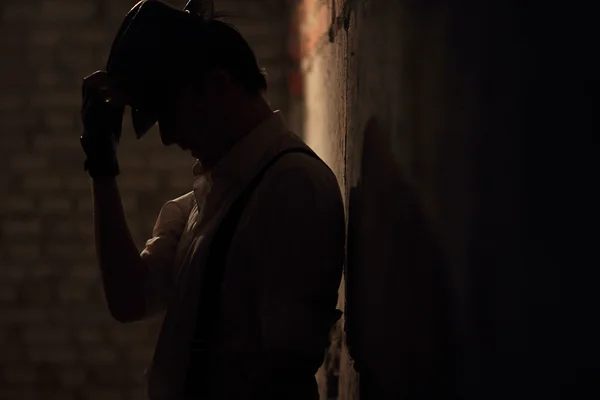 Portrait of young mafia man in hat Stock Picture