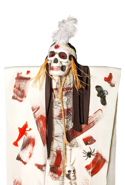 Halloween, death doll with red eye sockets, white feather and brown bandana on its head, isolated on white background, vertical image.