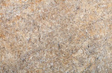Yüksek çözünürlüklü taş granit levhanın bej ve kahverengi soyut deseni.